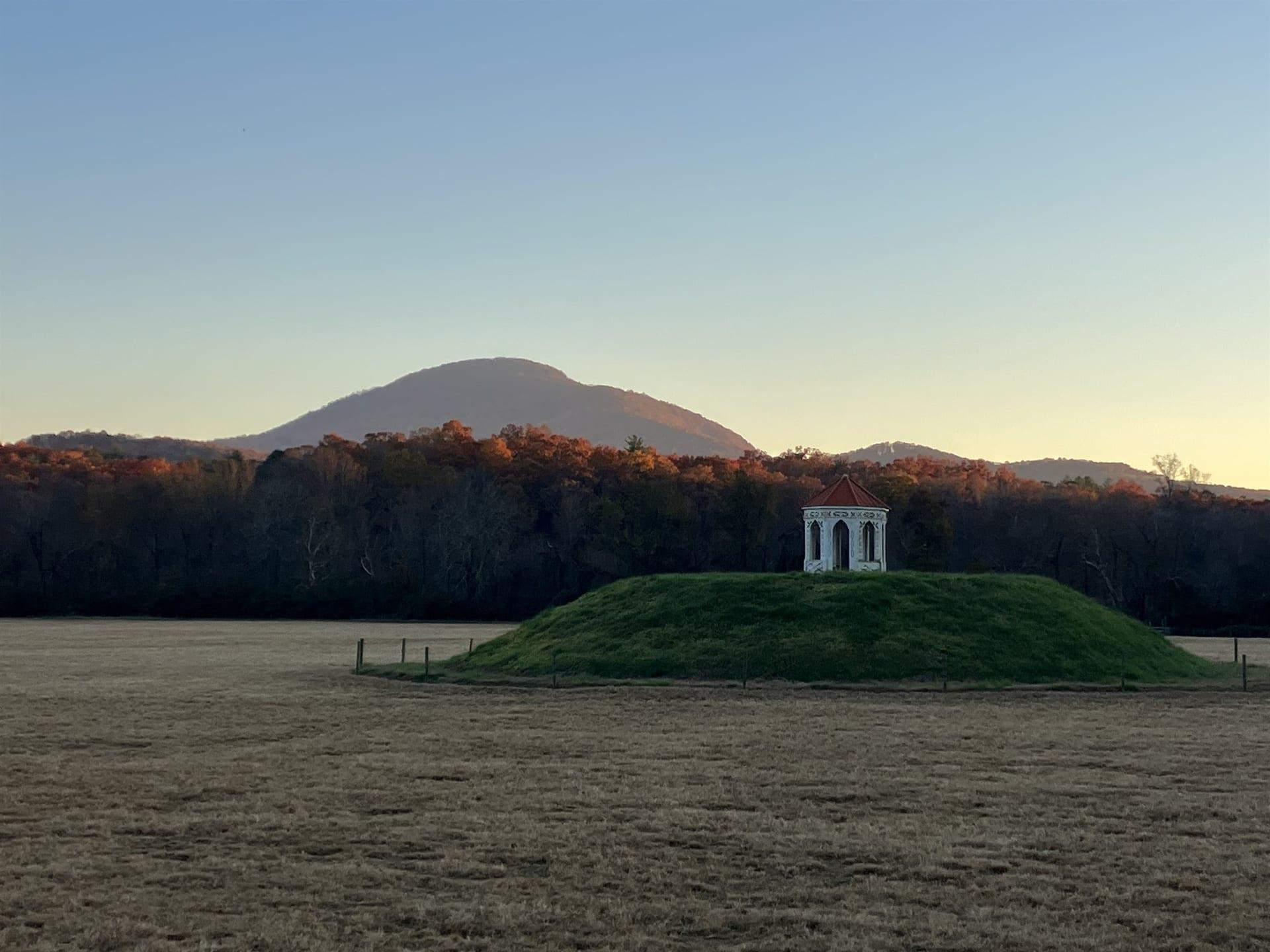 Nacoochee Mound and its gazebo below Mount Yonah, fall color on the ridges outside Helen, Georgia